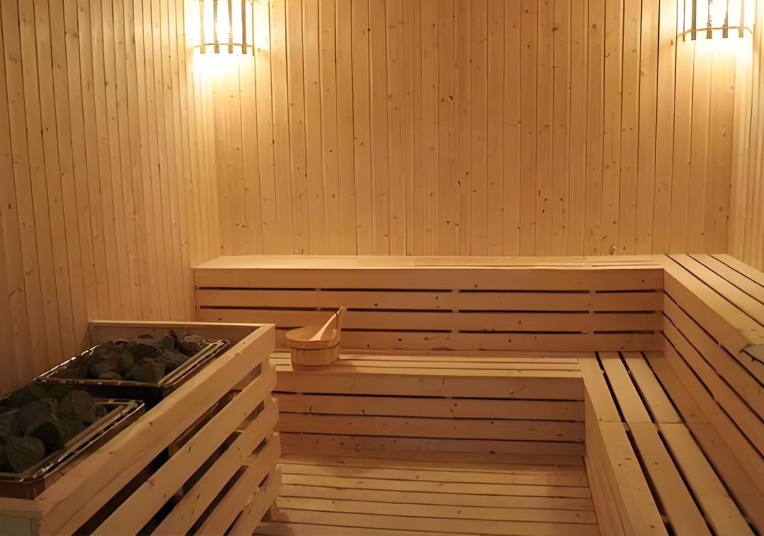 Person enjoying sauna session with timer visible
